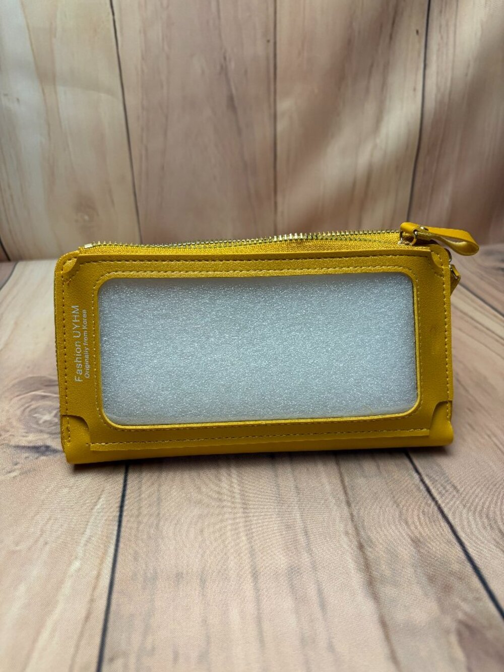 Yellow faux-leather touch-screen cell phone purse and wallet.